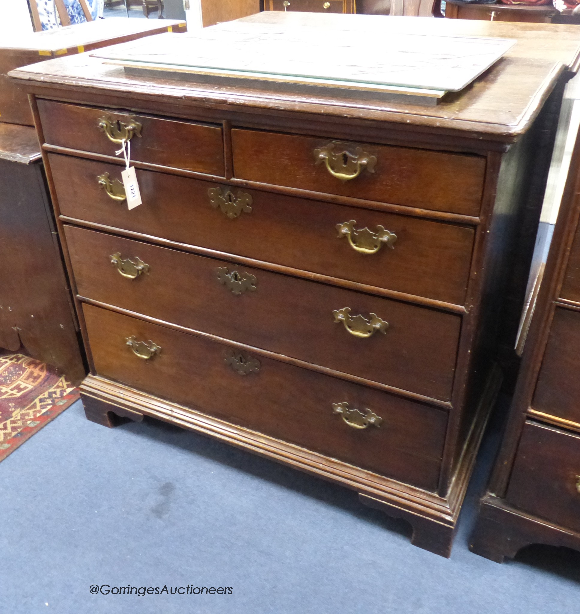 An 18th century oak chest fitted two short drawers and three long drawers on bracket feet, width 91cm, depth 49cm, height 82cm